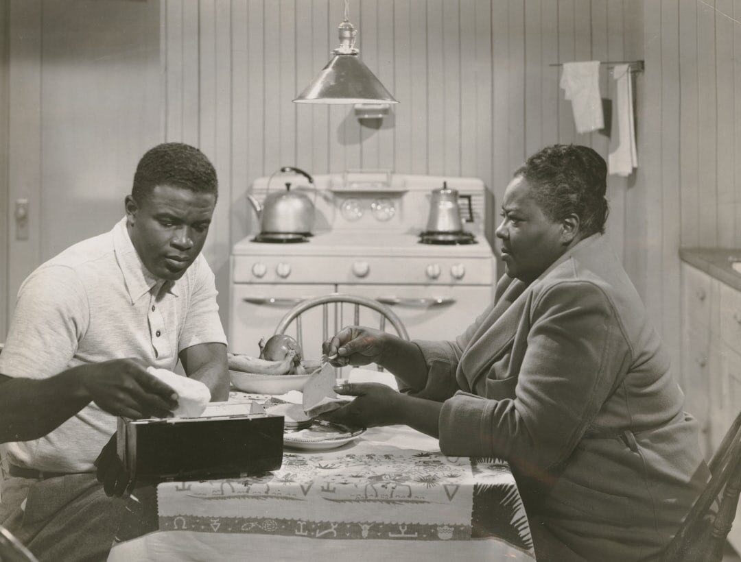 Diverse editorial team reviewing archive footage together around a table